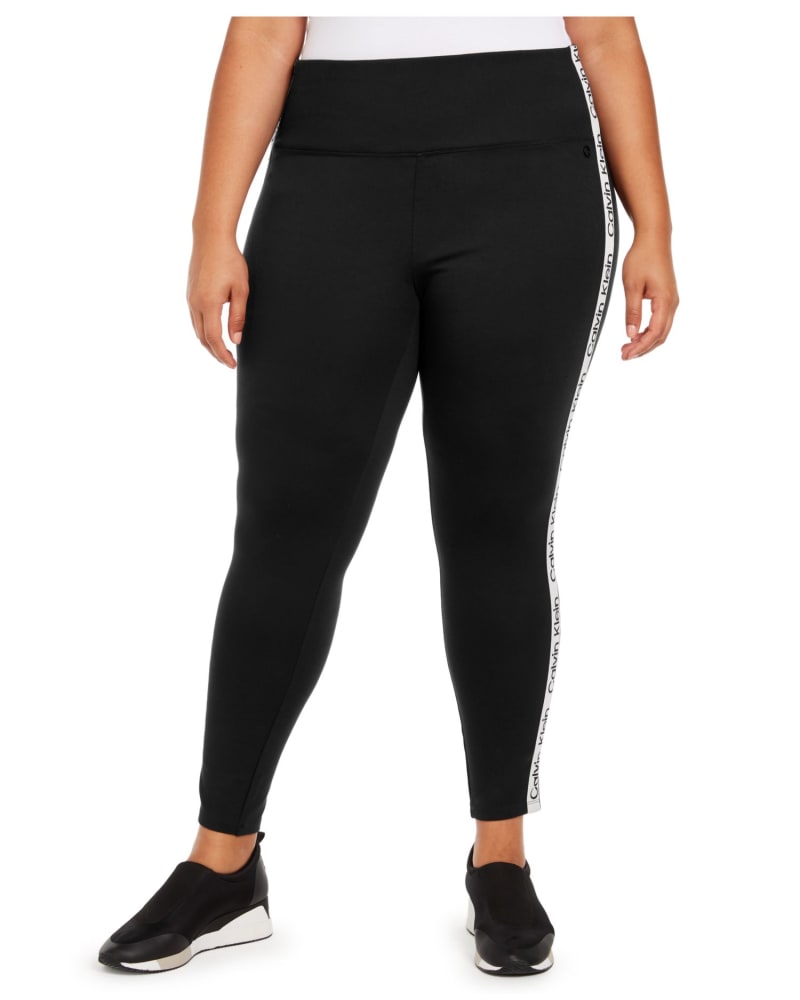 Front of a model wearing a size 1X Calvin Klein Women's Leggings Stretch Logo Black 1X in Black by Calvin Klein. | dia_product_style_image_id:306328